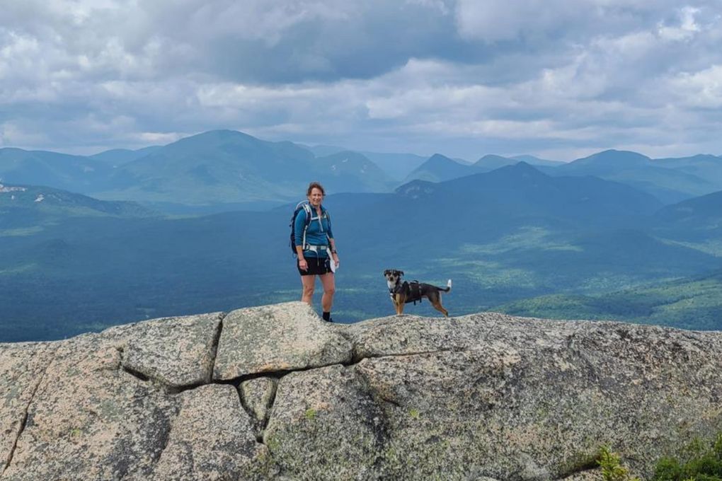 Tri-paw dog Zoey hikes in the mountains.